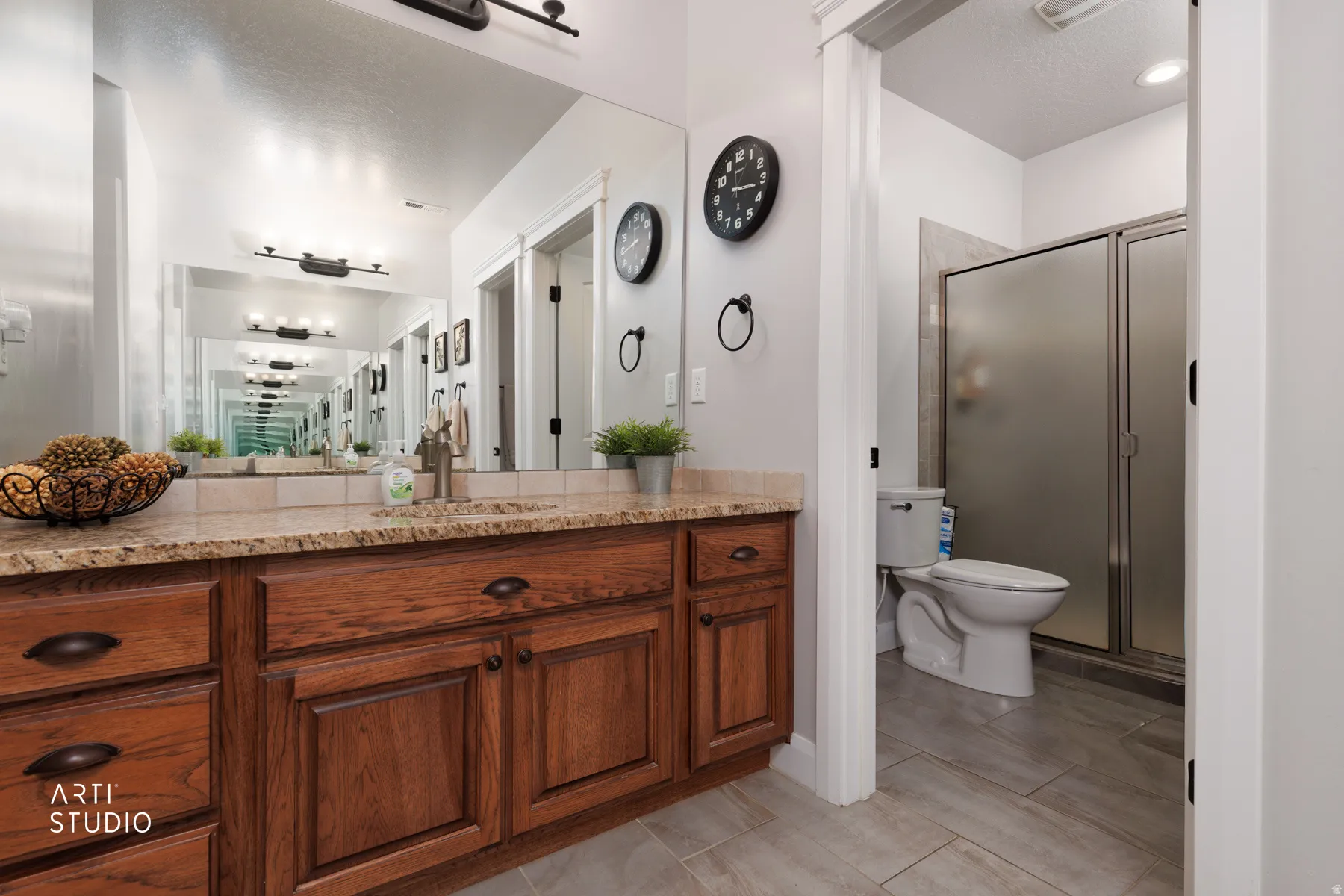 Full bathroom featuring vanity and a stall shower