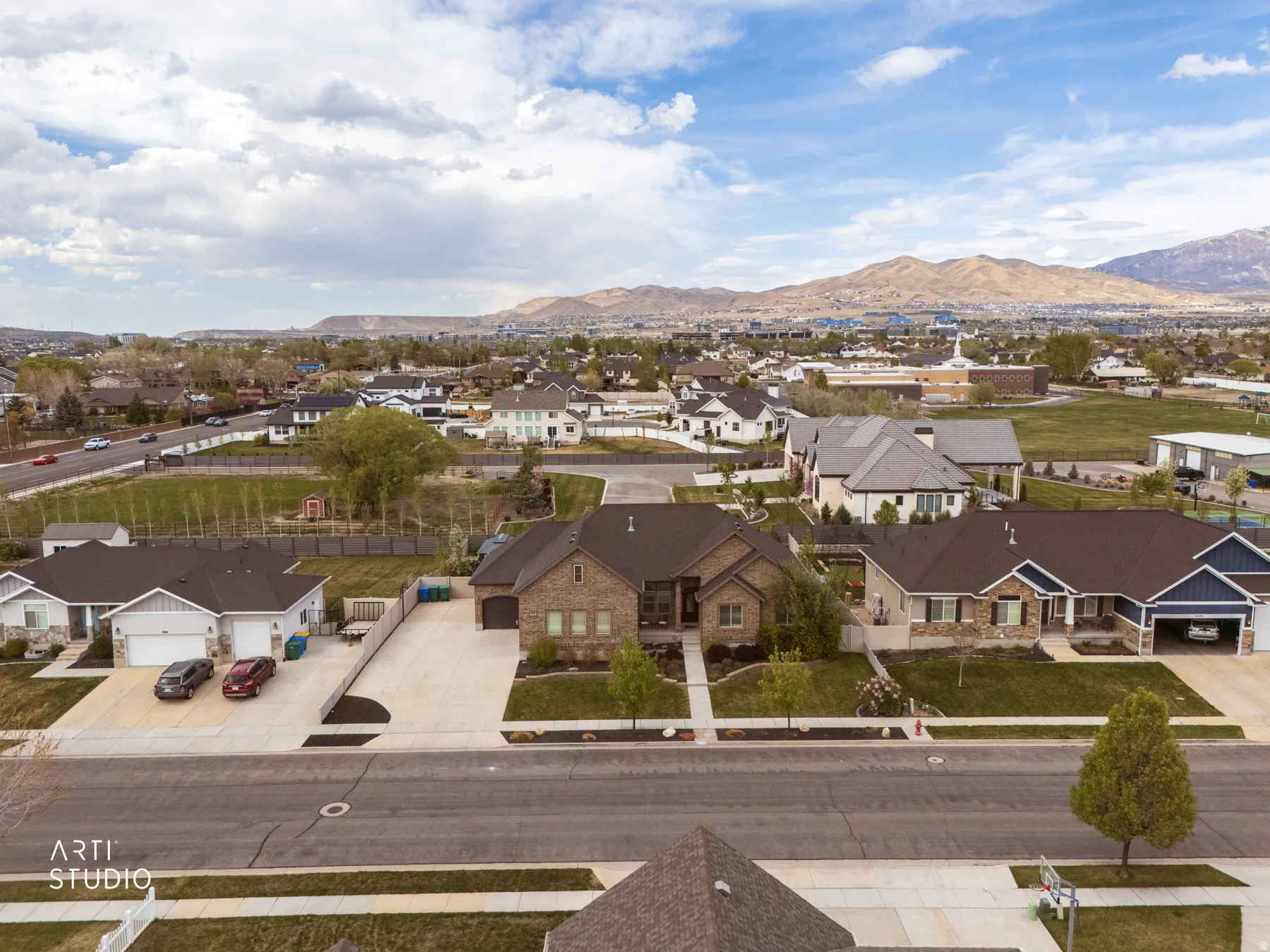 Aerial view of residential area featuring mountains