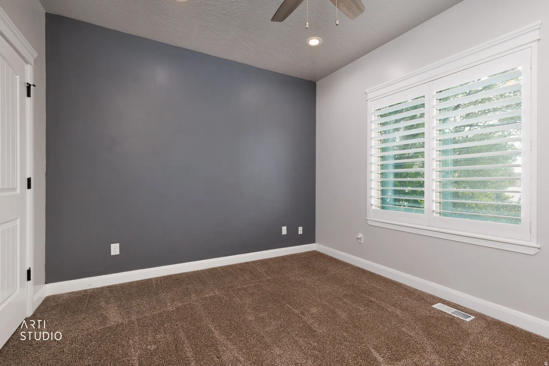 Unfurnished room featuring dark colored carpet, a textured ceiling, recessed lighting, and ceiling fan