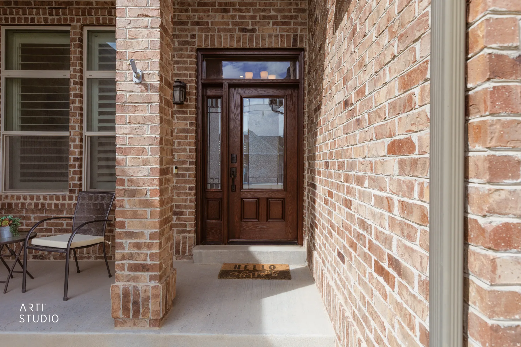 Entrance to property with brick siding