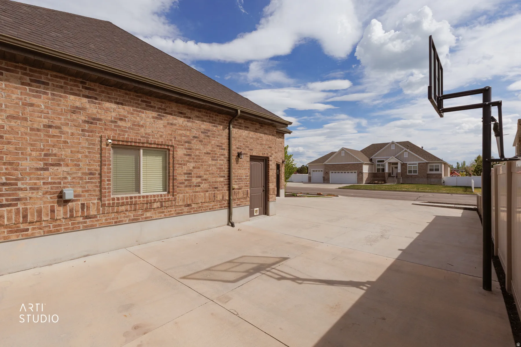 View of patio / terrace featuring a garage and concrete driveway