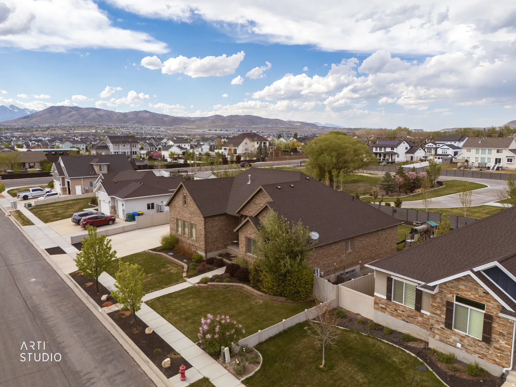 Aerial perspective of suburban area with a mountain backdrop