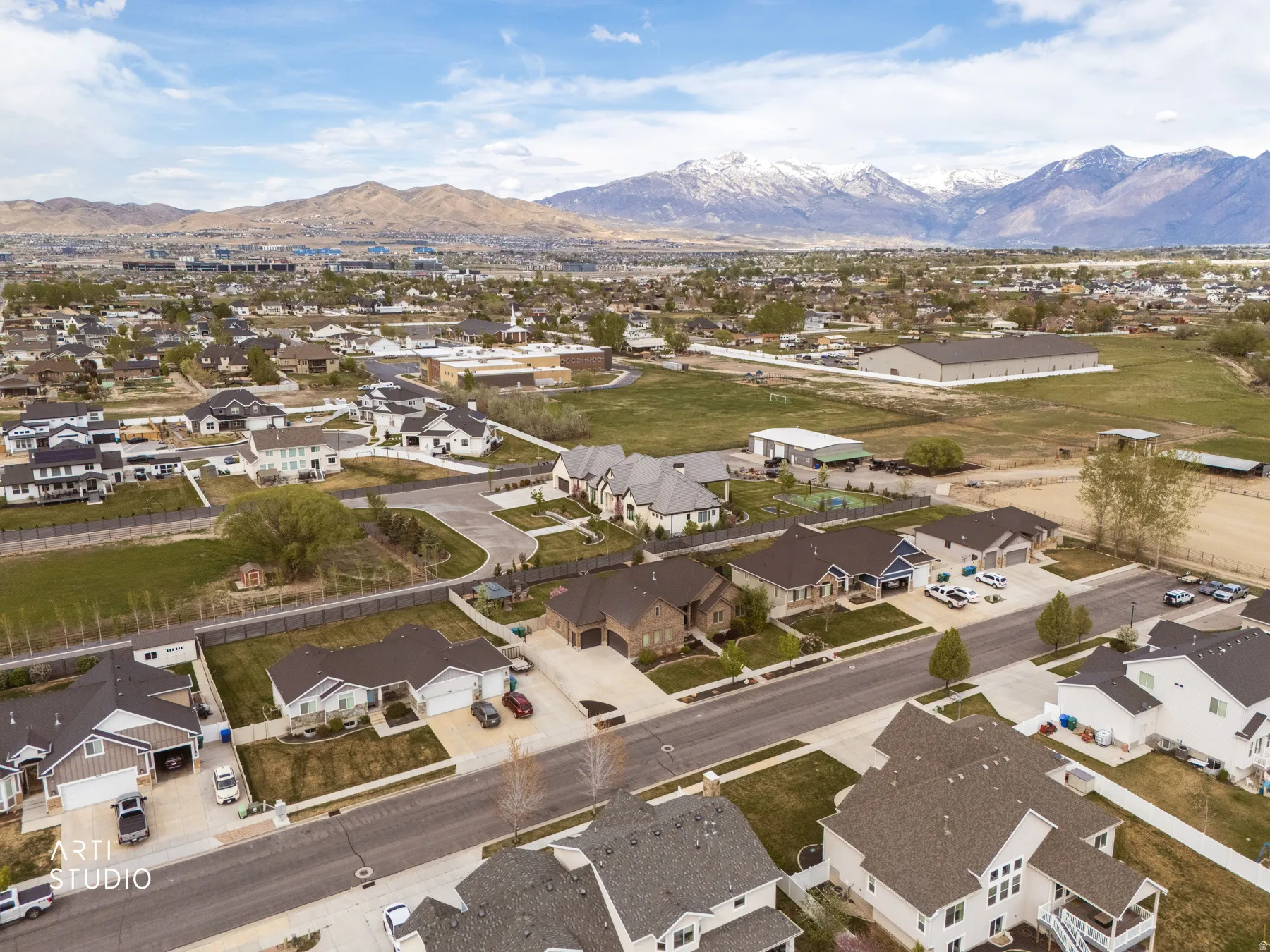 Aerial view of residential area featuring a mountain backdrop
