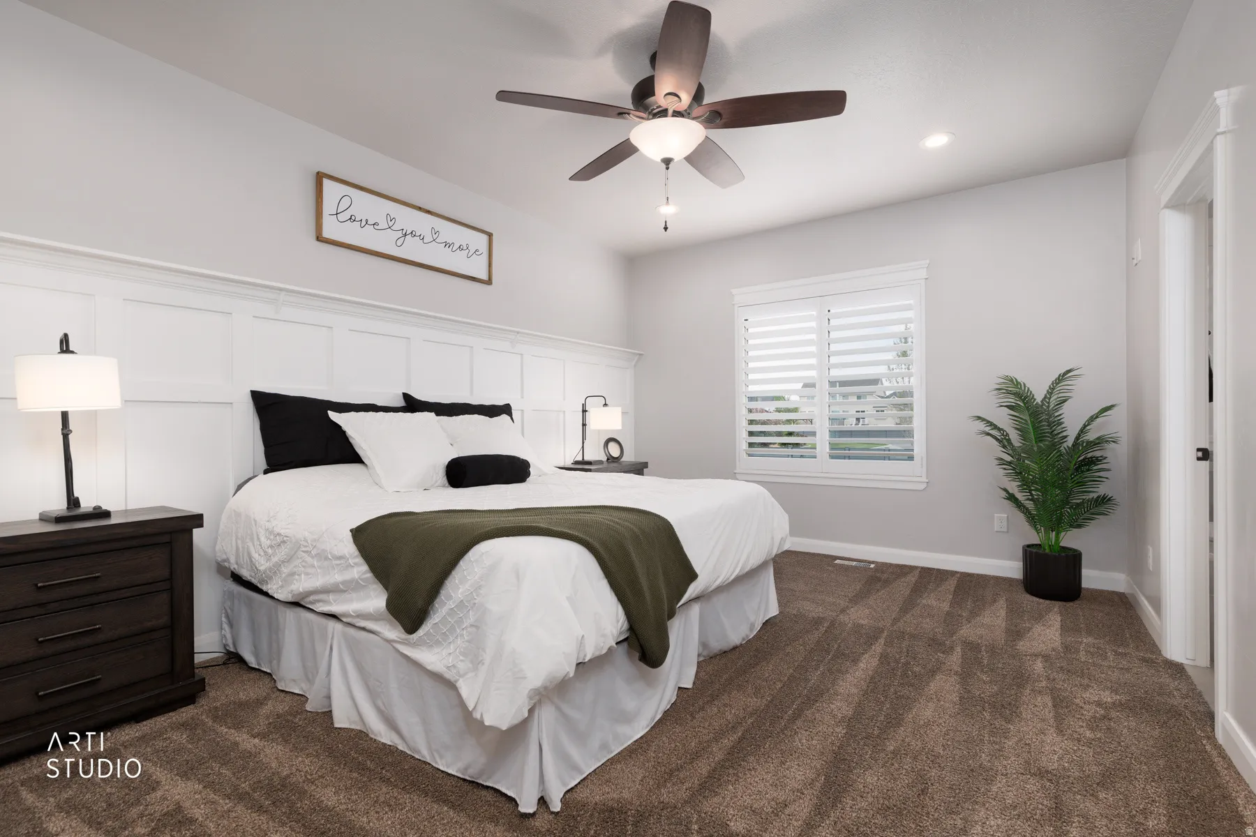 Bedroom with dark colored carpet, ceiling fan, and recessed lighting