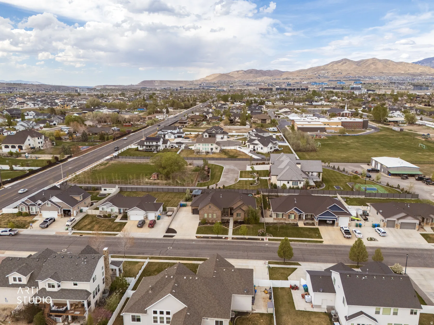 Aerial view of residential area featuring a mountainous background