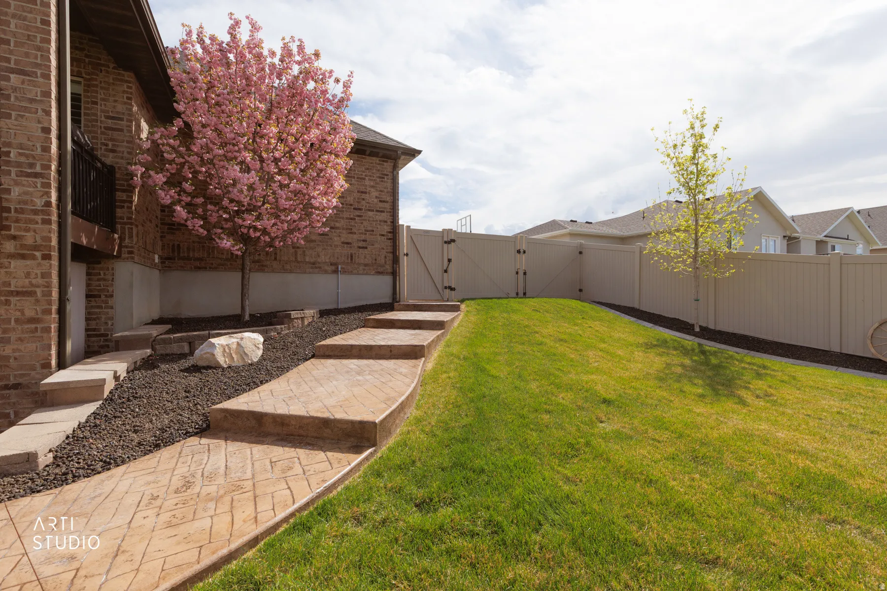 Fenced backyard with a gate