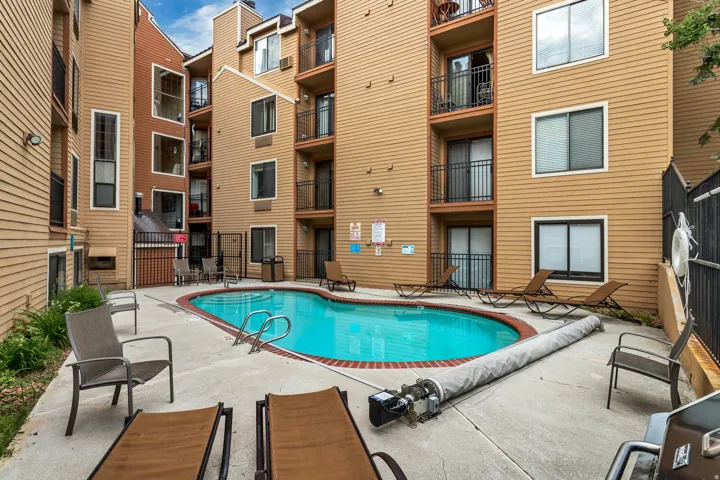 Community pool featuring a patio