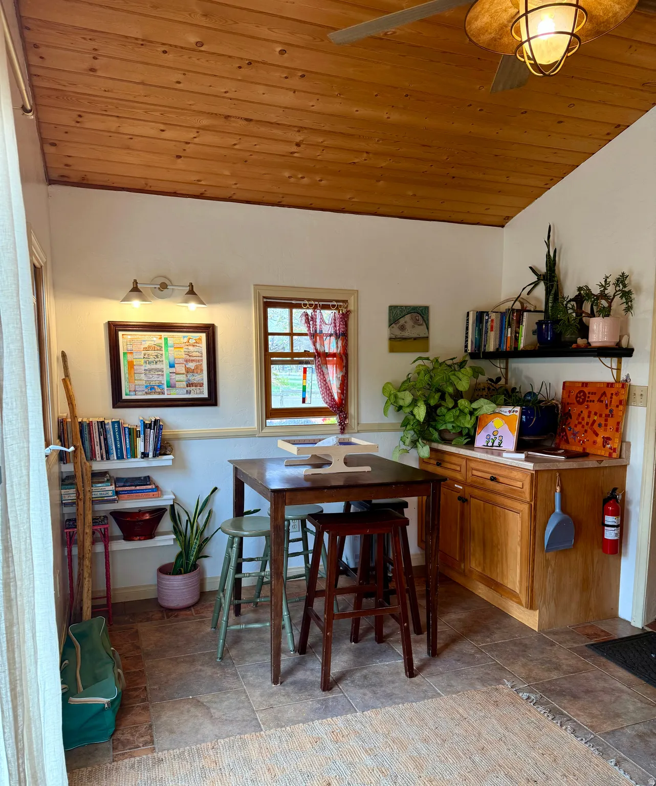 Dining room featuring a vaulted wood ceiling and ceiling fan