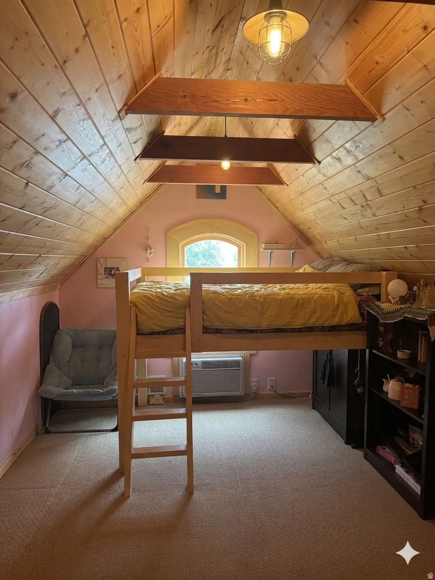 Bedroom with light carpet and a wood ceiling with exposed beams