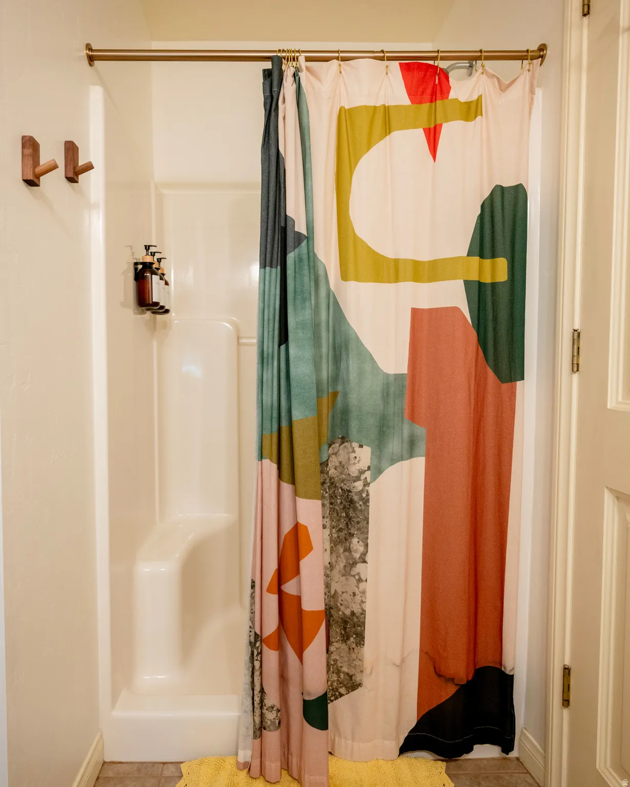 Full bath featuring a shower stall