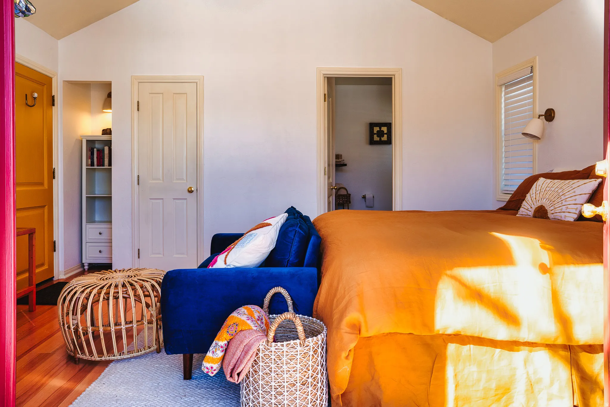 Bedroom featuring vaulted ceiling and wood finished floors