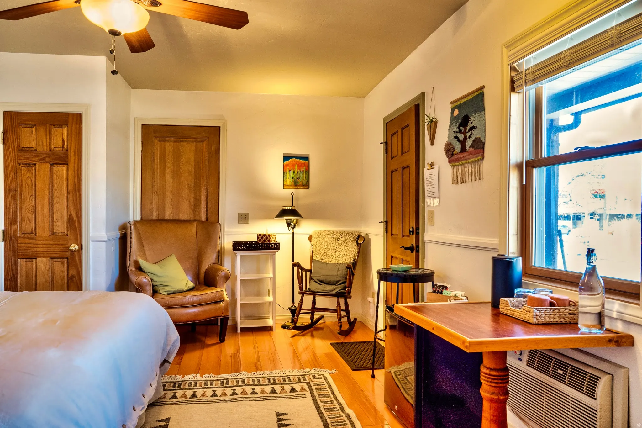 Bedroom with light wood-type flooring and a ceiling fan