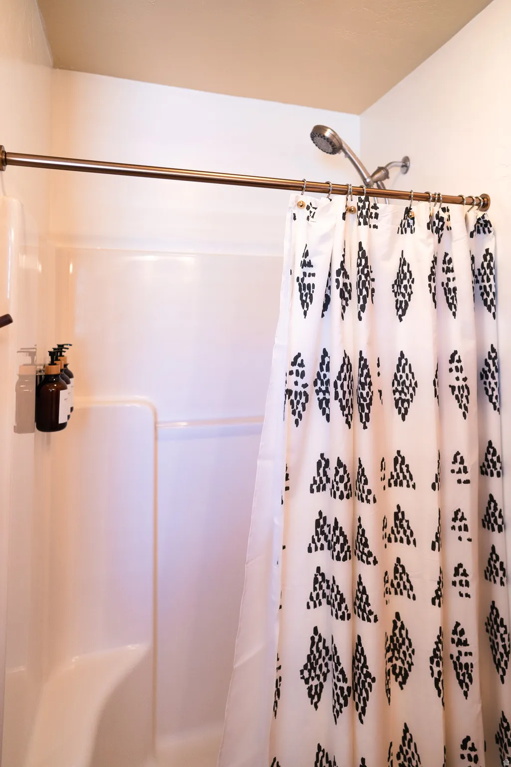 Full bathroom featuring a shower with curtain