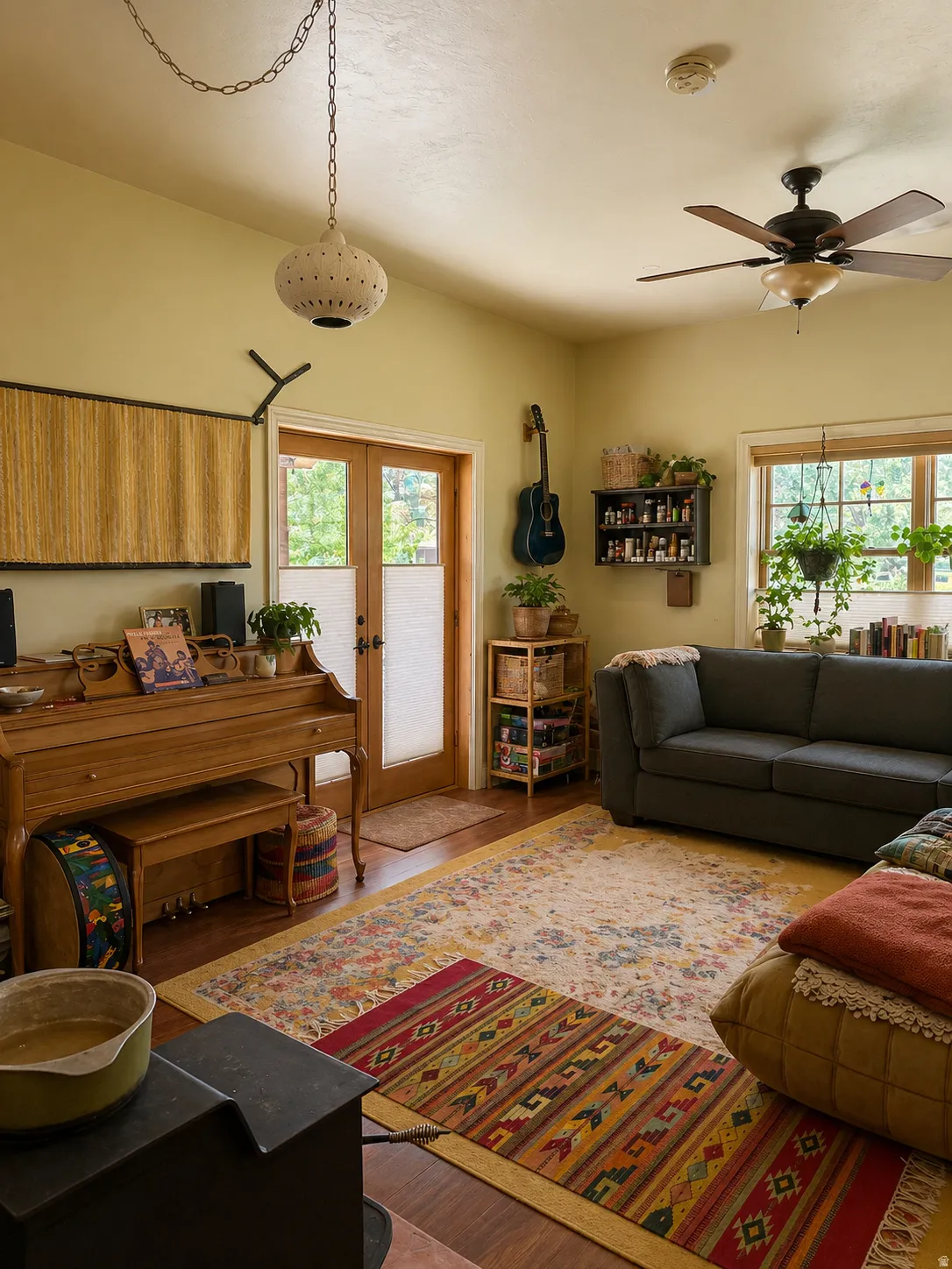 Living area featuring light wood-style floors, french doors, ceiling fan, and healthy amount of natural light