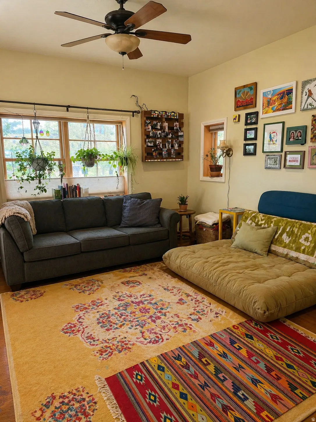 Living area with ceiling fan and wood finished floors