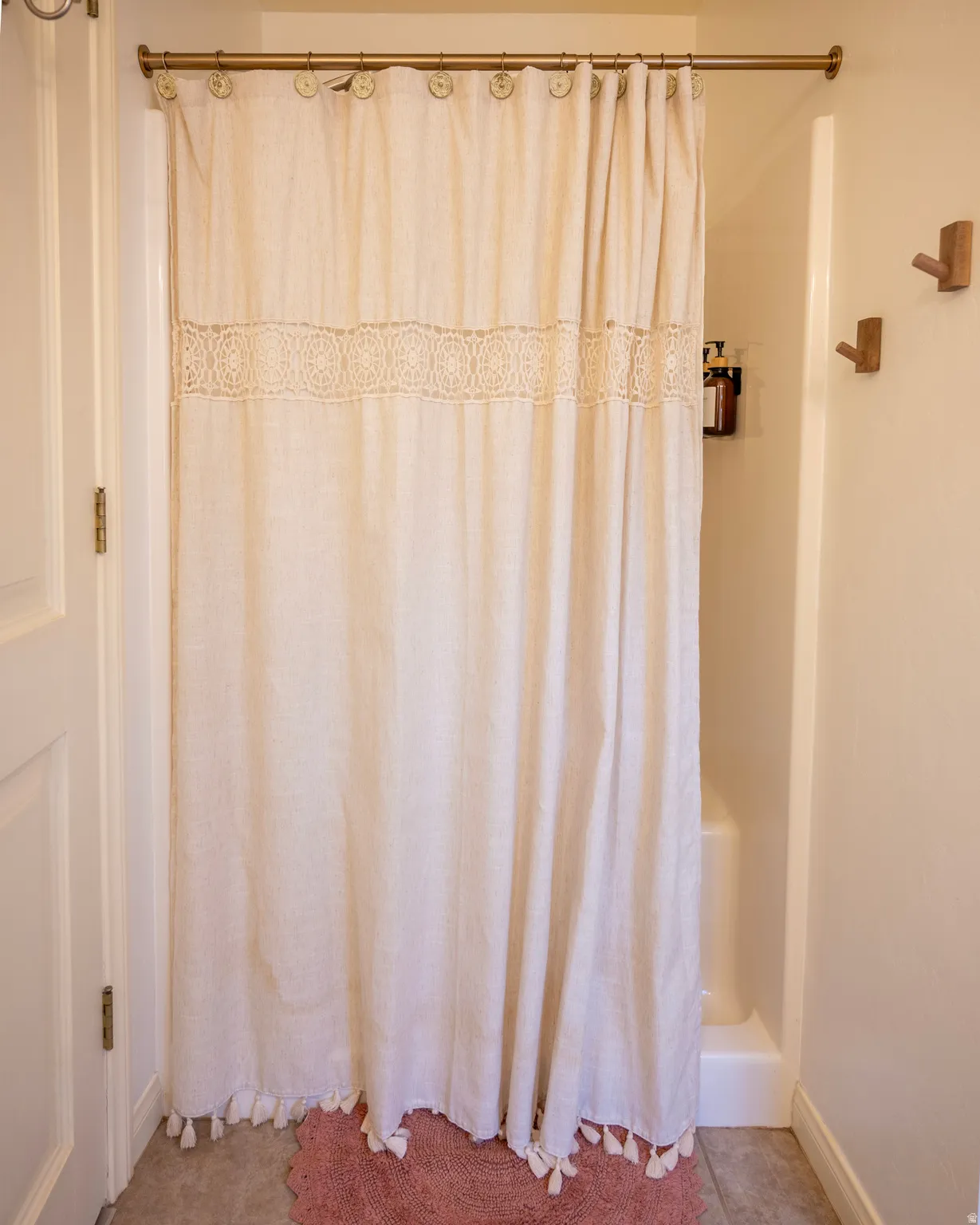 Full bathroom with baseboards and shower / bath combination with curtain