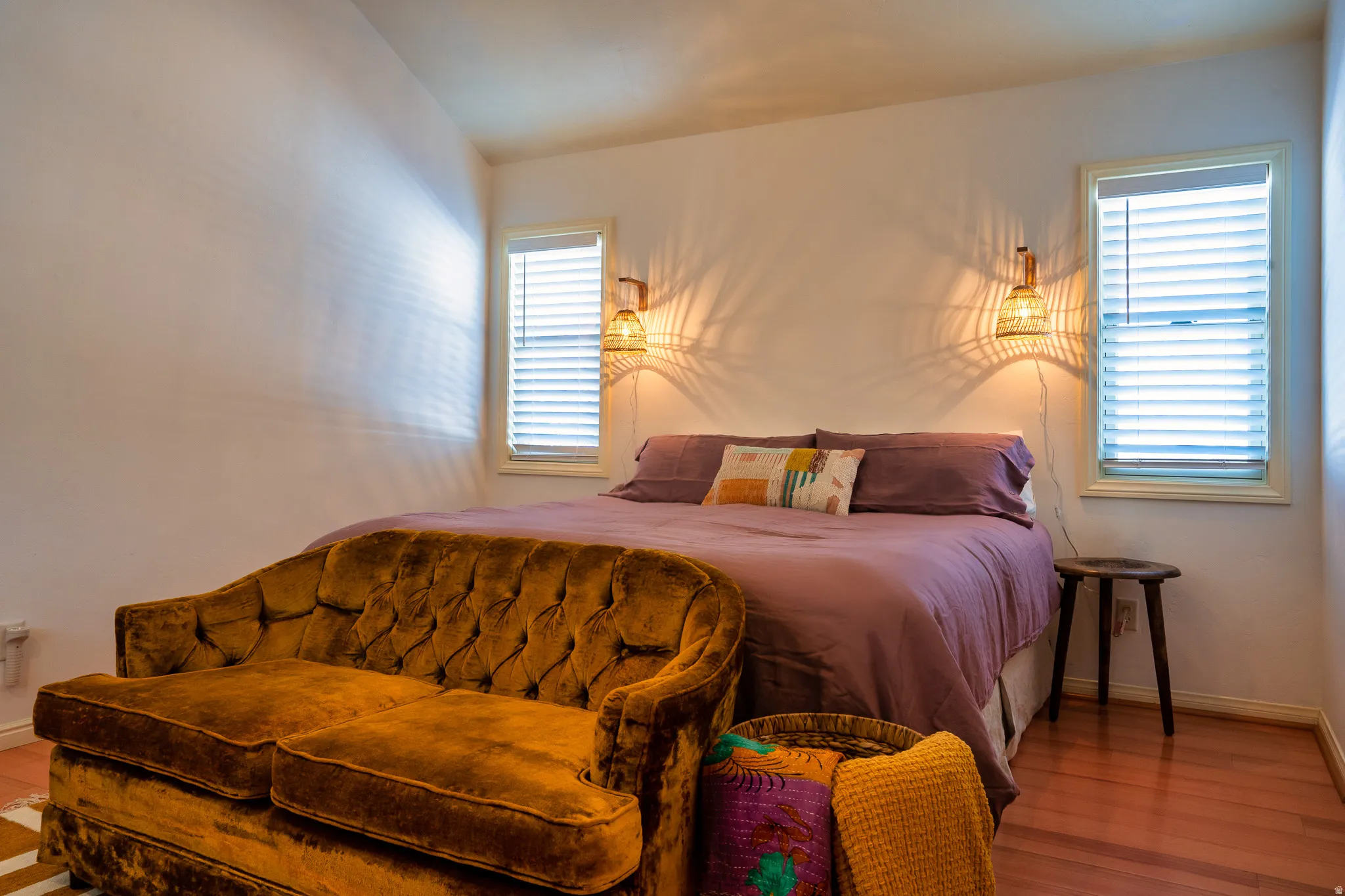 Bedroom with baseboards and wood finished floors