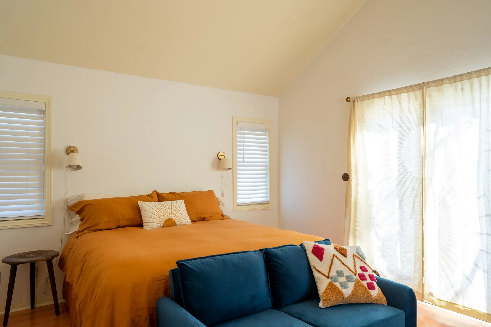 Bedroom featuring vaulted ceiling and wood finished floors