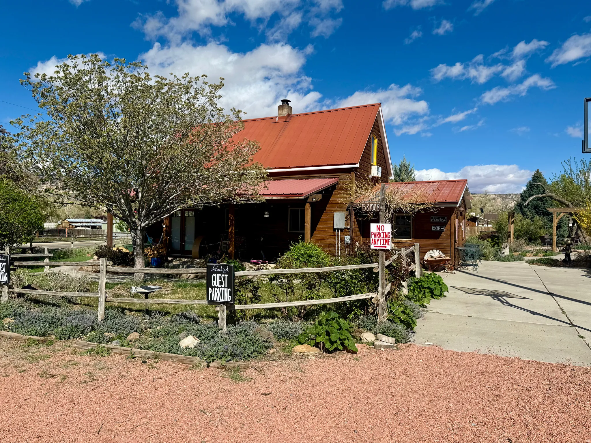 View of front of property featuring a metal roof, a fenced front yard, and a chimney
