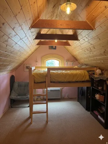 Bedroom with light carpet and a wood ceiling with exposed beams
