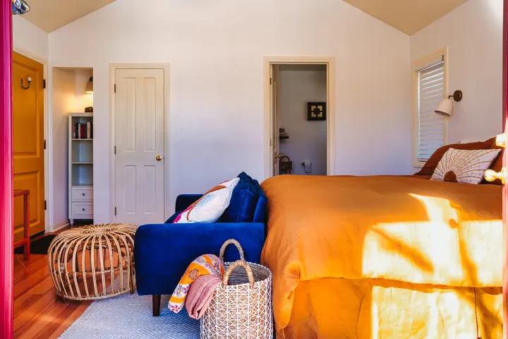 Bedroom featuring vaulted ceiling and wood finished floors