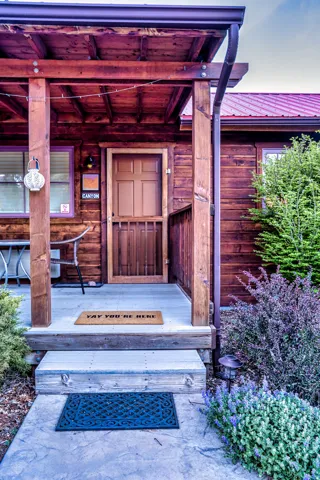 Doorway to property with a metal roof