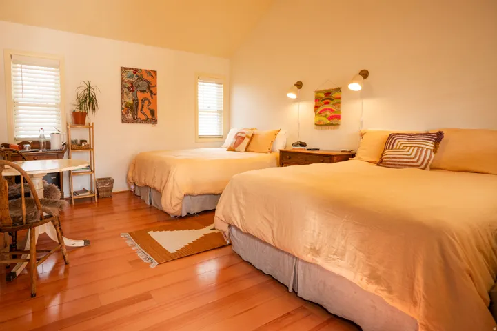 Bedroom featuring light wood-style floors and vaulted ceiling