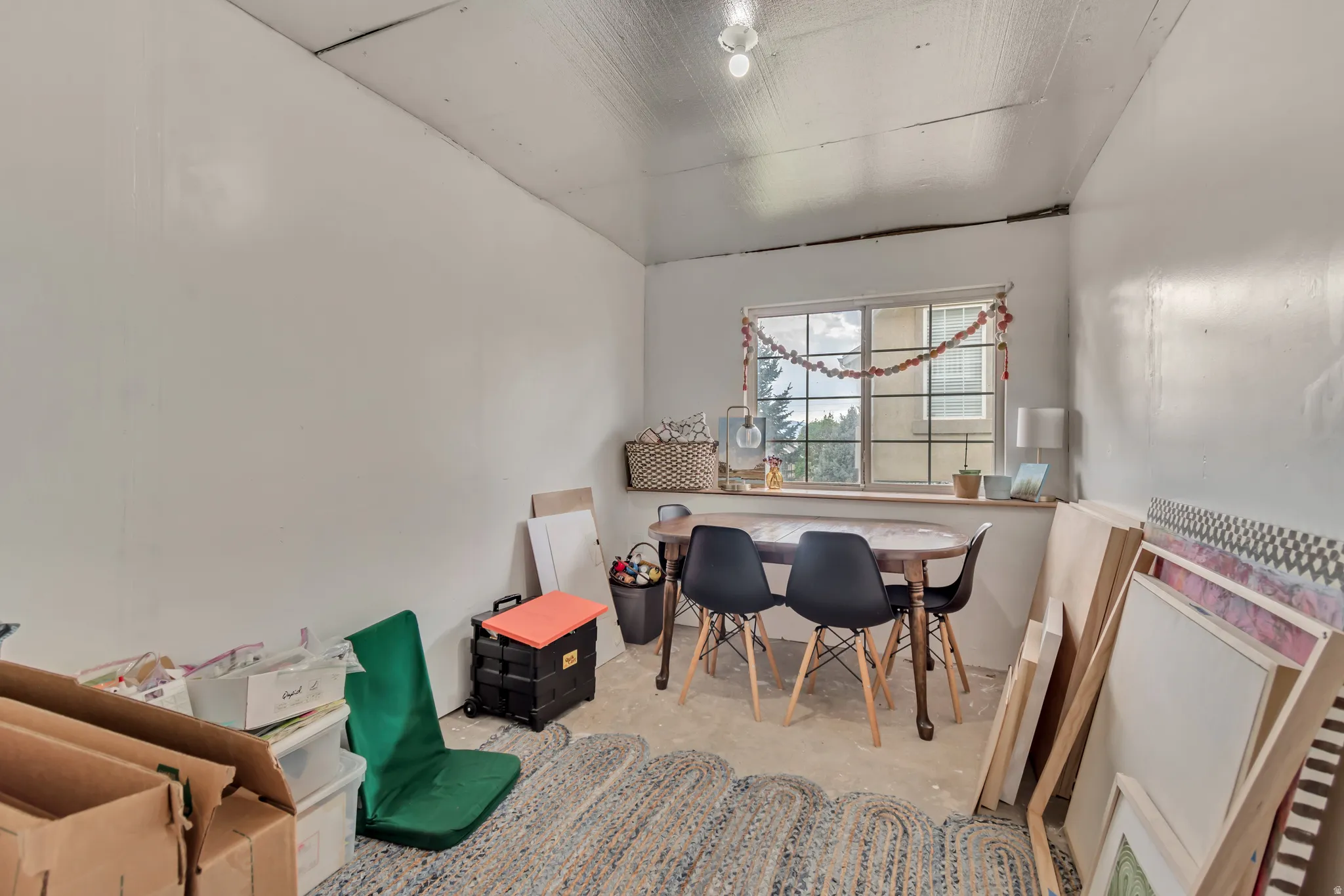 Home office with unfinished concrete flooring