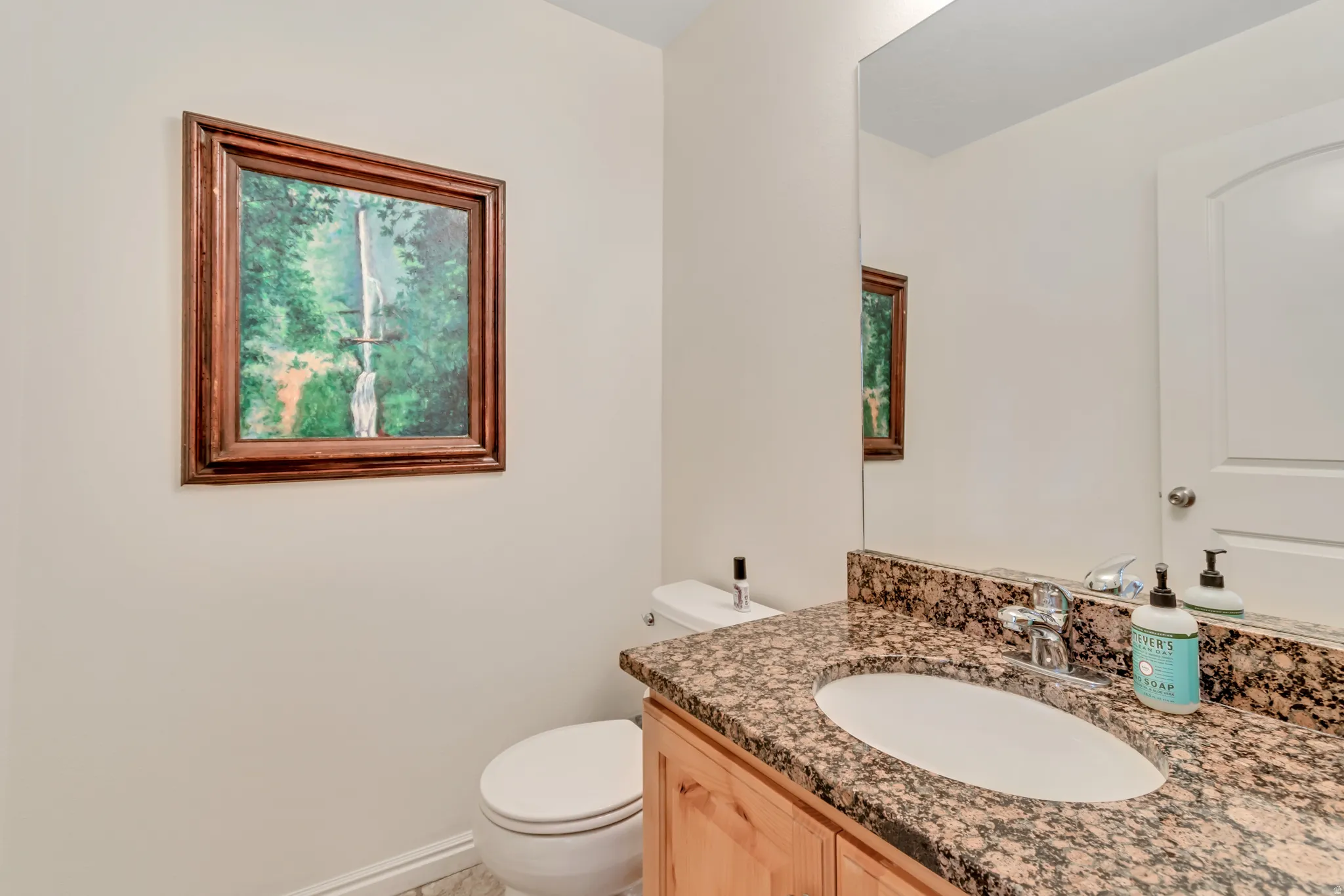 Bathroom with vanity and toilet