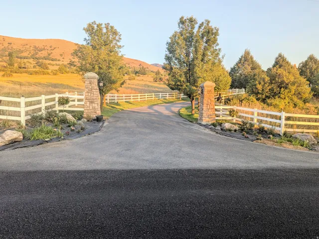 Gate with a mountain view and a rural view