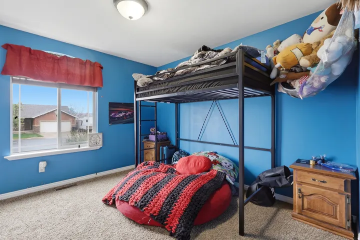 Carpeted bedroom with baseboards