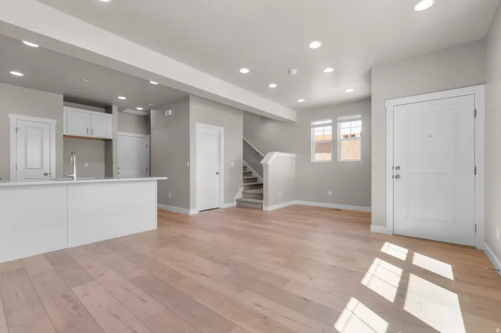 Unfurnished living room featuring light wood-style flooring and recessed lighting