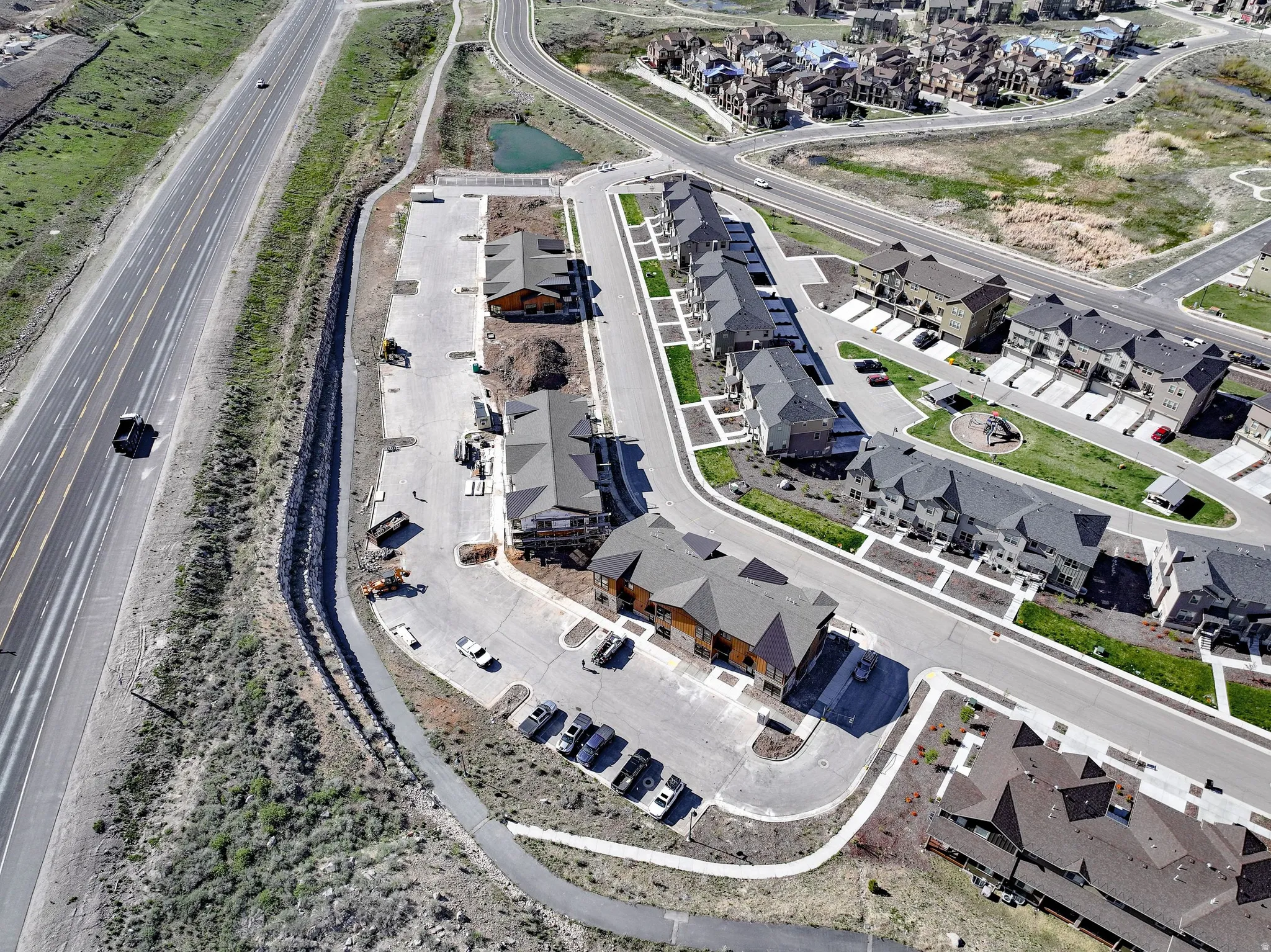 Aerial view of property's location with nearby suburban area
