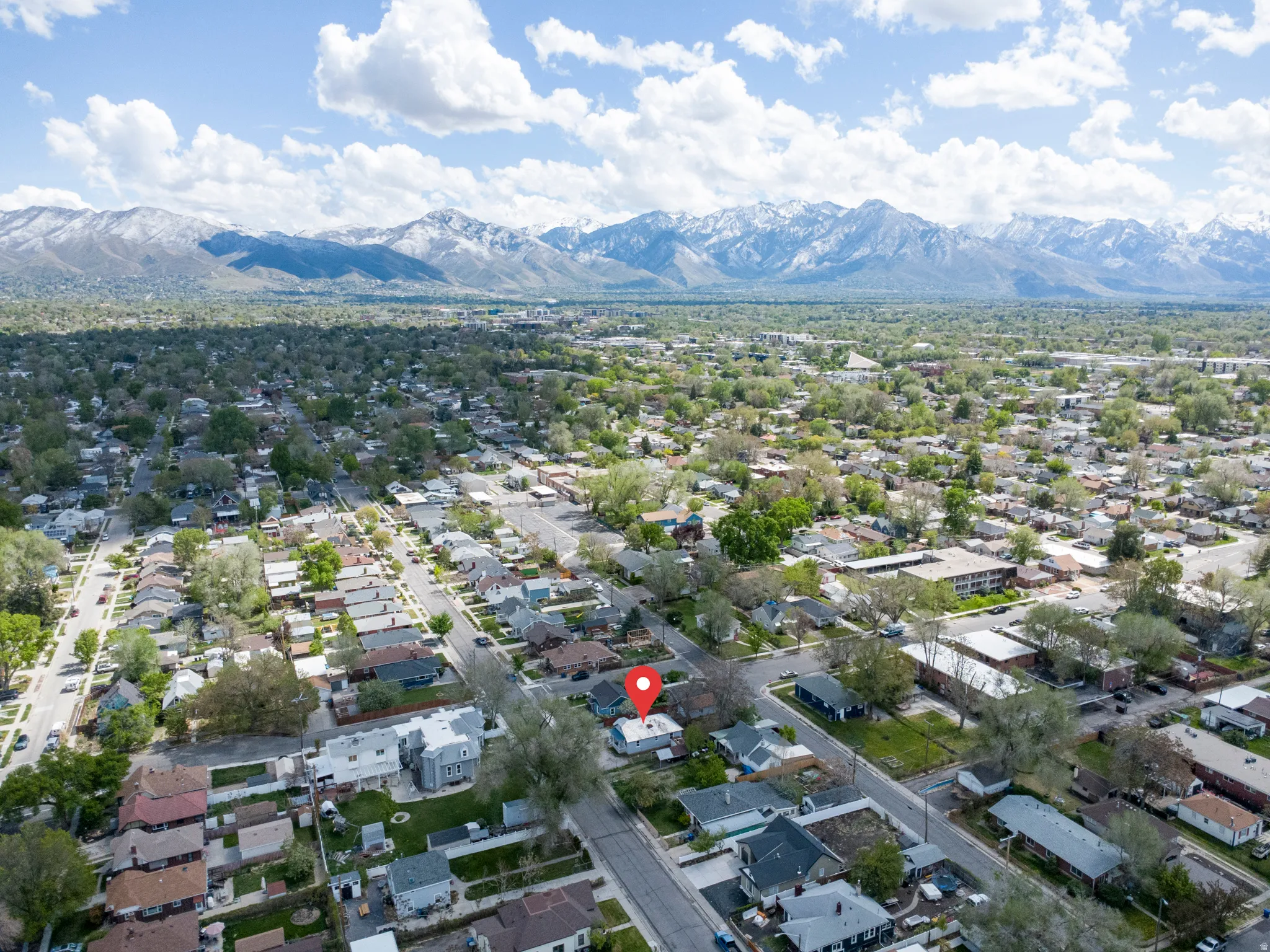 Aerial view of residential area with a mountain backdrop
