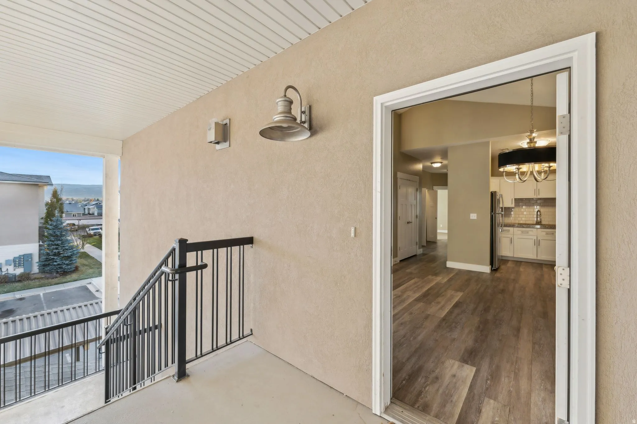 Doorway to property with stucco siding