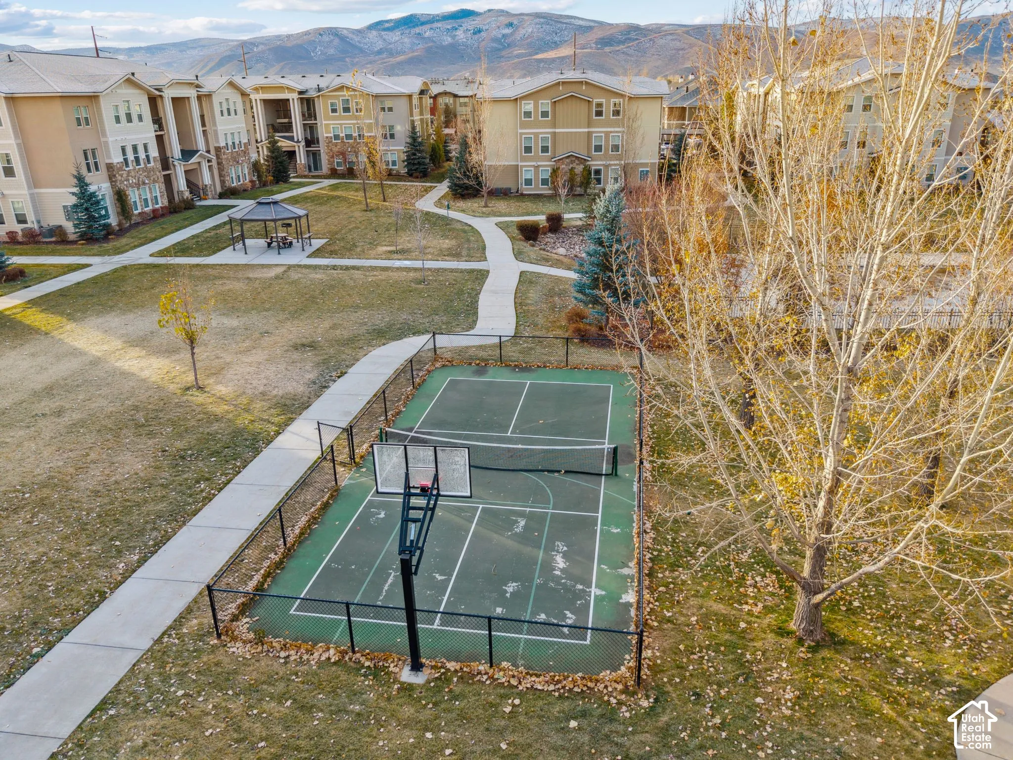 View of home's community with a mountain view, community basketball court, and a residential view