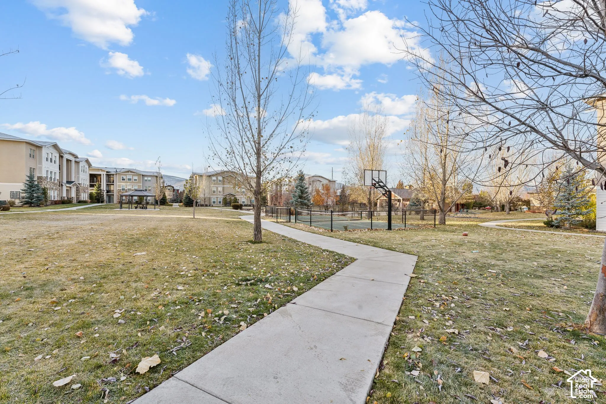 View of home's community featuring a residential view and community basketball court