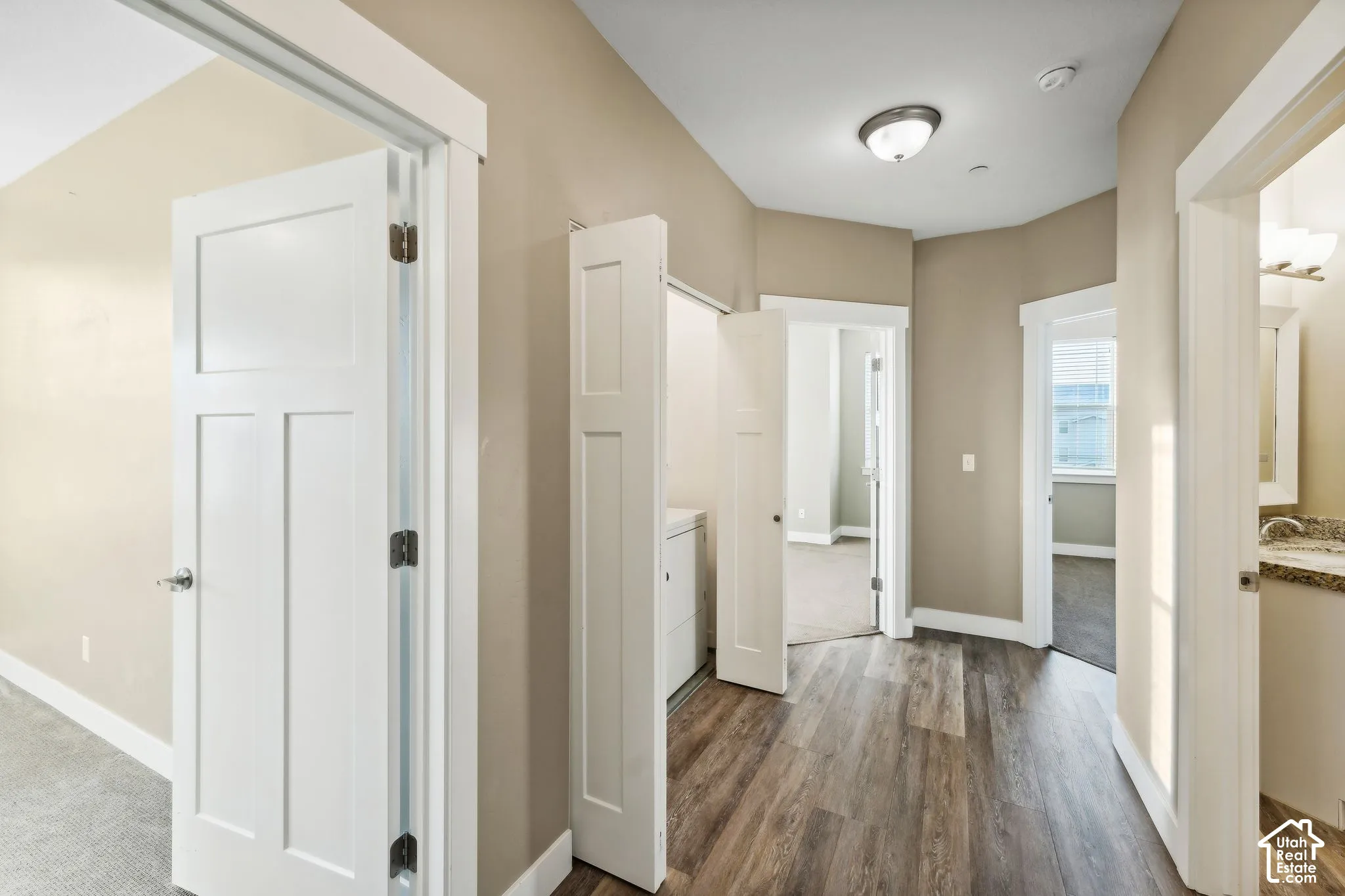 Hallway featuring dark wood-style flooring