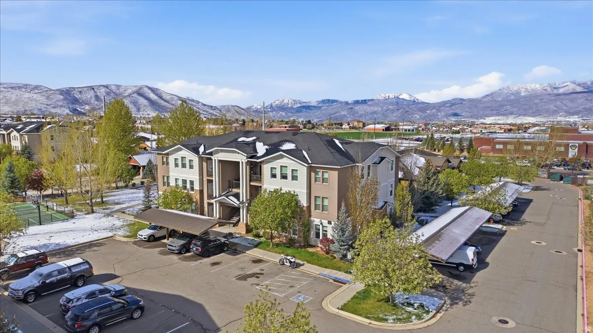Aerial perspective of suburban area with a mountainous background