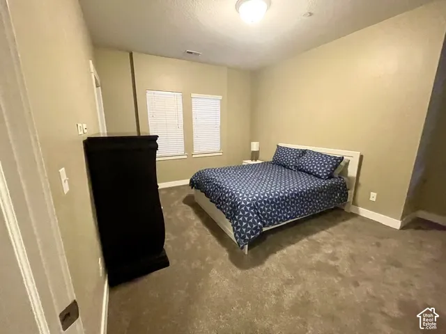 Wall-to-wall carpeting and neutral wall tones