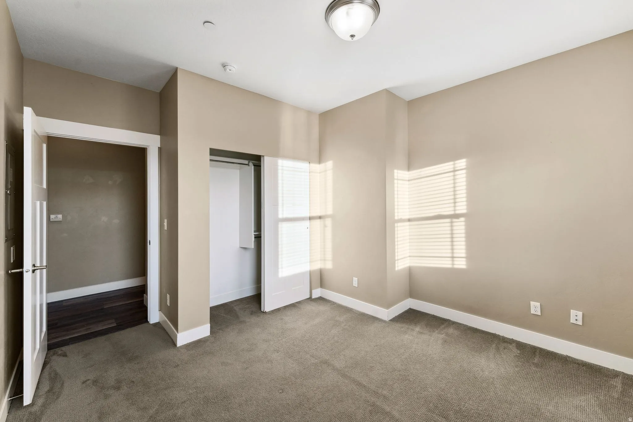 Unfurnished bedroom with a closet and carpet floors