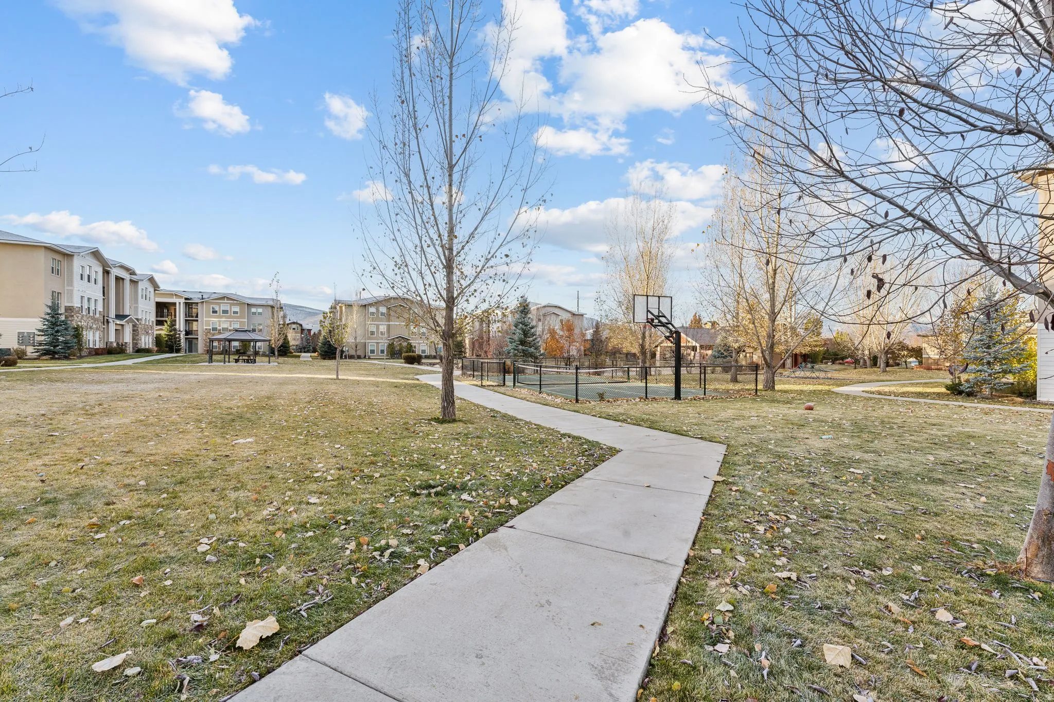 View of home's community featuring a residential view and community basketball court
