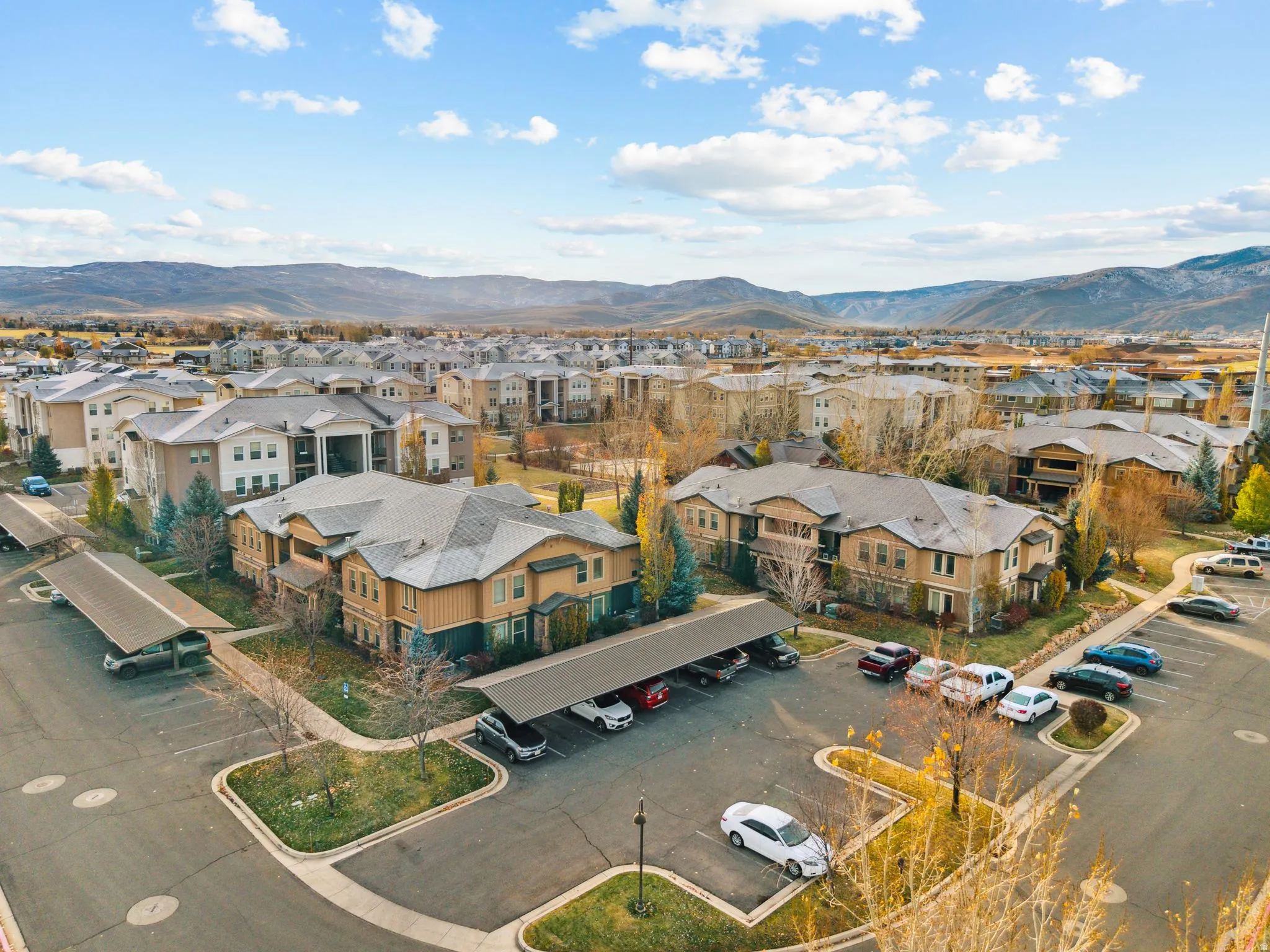 Aerial perspective of suburban area with a mountainous background