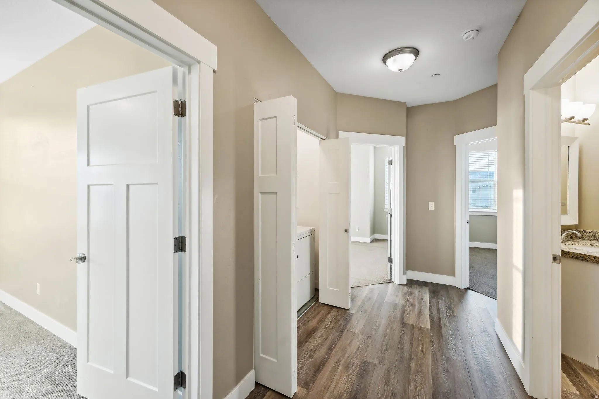 Hallway featuring dark wood-style flooring