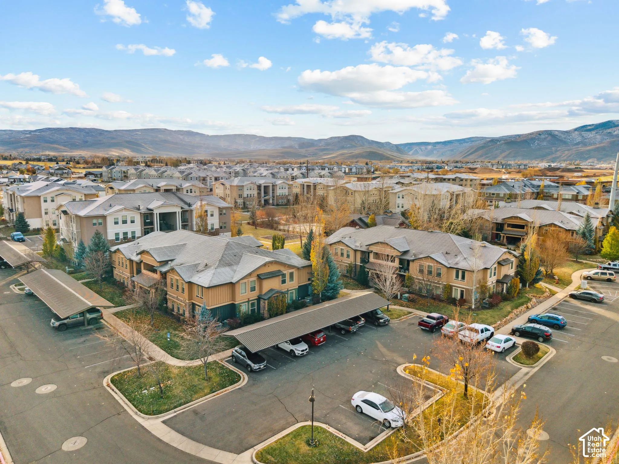 Aerial perspective of suburban area with a mountainous background