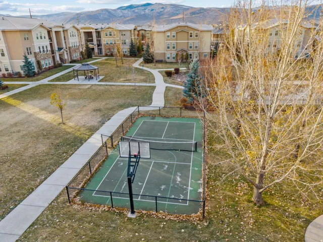 View of home's community with a mountain view, community basketball court, and a residential view