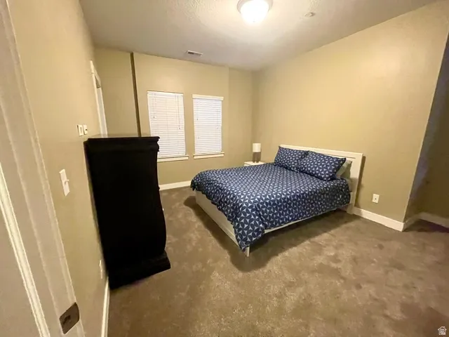 Wall-to-wall carpeting and neutral wall tones