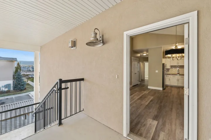 Doorway to property with stucco siding