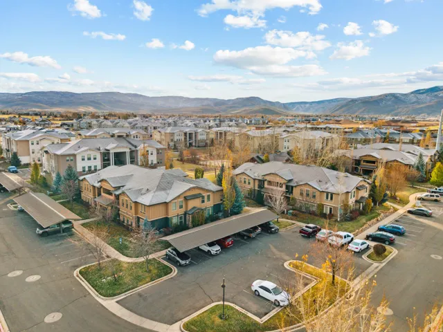 Aerial perspective of suburban area with a mountainous background