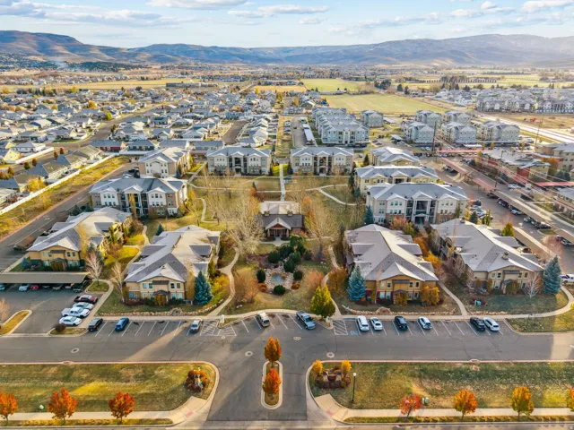 Aerial view of property and surrounding area with mountains